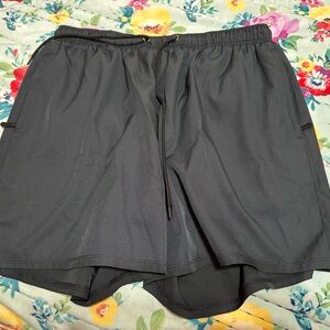 Men’s silk world swim shorts with compression lining. Size large